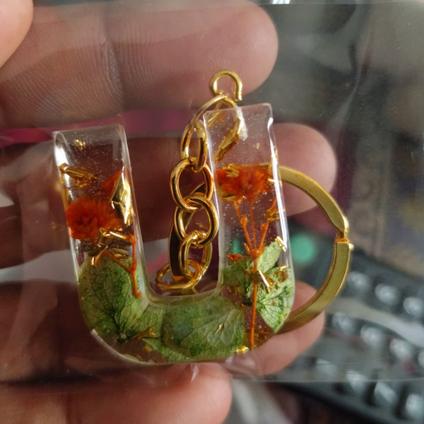 Handmade Resin Alphabet Keychain – Letter U with Orange Flowers and Green Leaves